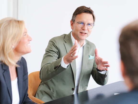 Christian Janas, Head of Asset Management, in conversation with colleagues